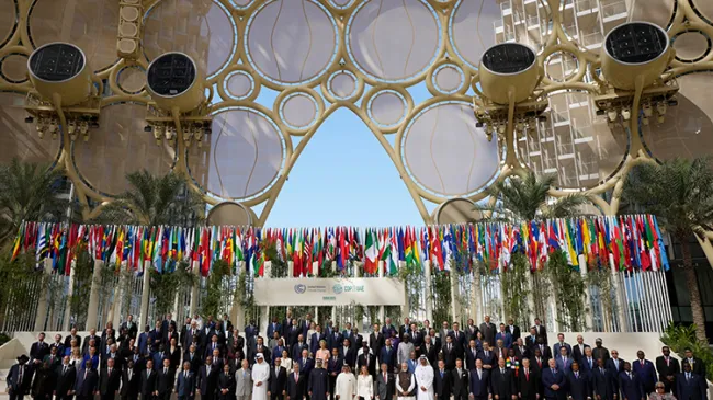 World leaders pose for a group photos at the COP28 U.N. Climate Summit, Friday, Dec. 1, 2023, in Dubai, United Arab Emirates. (AP Photo/Peter Dejong)
